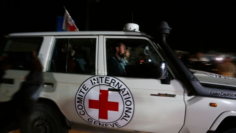 A Red Cross convoy carrying Israeli hostages heads to Egypt from the Gaza Strip at the Rafah border crossing on Sunday, Nov. 26, 2023. (AP Photo/Hatem Ali)