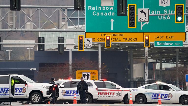 Police officers block the entrance to the Rainbow Bridge in Niagara Falls