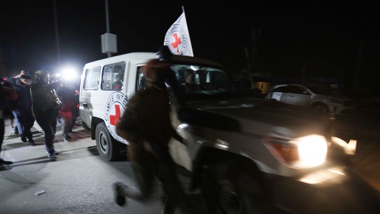 A Red Cross vehicle, as part of a convoy believed to be carrying hostages abducted by Hamas militants during the October 7 attack on Israel, arrives at the Rafah border, amid a hostages-prisoners swap deal between Hamas and Israel, in southern Gaza Strip November 25, 2023. REUTERS/Ibraheem Abu Mustafa
