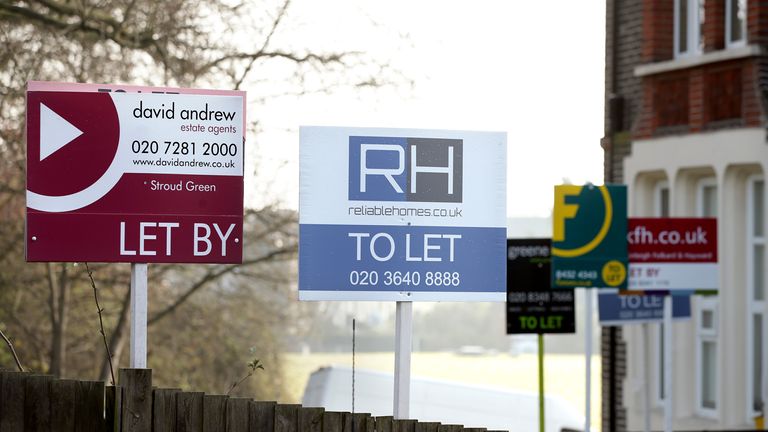 Estate agent signs placed outside homes. Pic: PA