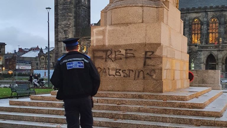Rochdale cenotaph with the words &#39;Free Palestine&#39; spray painted across it