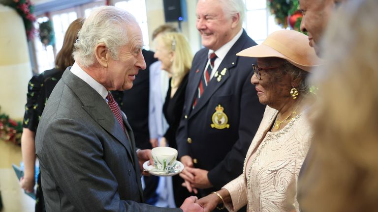 King Charles III&#39;s shakes hands with Jessie Stephens, sitter of the Windrush: Portraits of a Pioneering Generation as Charles attends his 75th birthday party at Highgrove Gardens in Tetbury on the eve of his birthday, with community champions who are also celebrating turning 75 in 2023. Picture date: Monday November 13, 2023. PA Photo. See PA story ROYAL King. Photo credit should read: Chris Jackson/PA Wire                                           