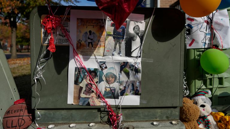 Images of Dominic Davis, an 11-year-old boy who was killed in a weekend shooting, are part of a makeshift memorial, Monday, Nov 6, 2023, in Cincinnati. Police Chief Terri Theetge told reporters Sunday that a shooter in a sedan fired 22 rounds "in quick succession" into a crowd of children just before 9:30 p.m. Friday on the city&#39;s West End. (AP Photo/Carolyn Kaster)