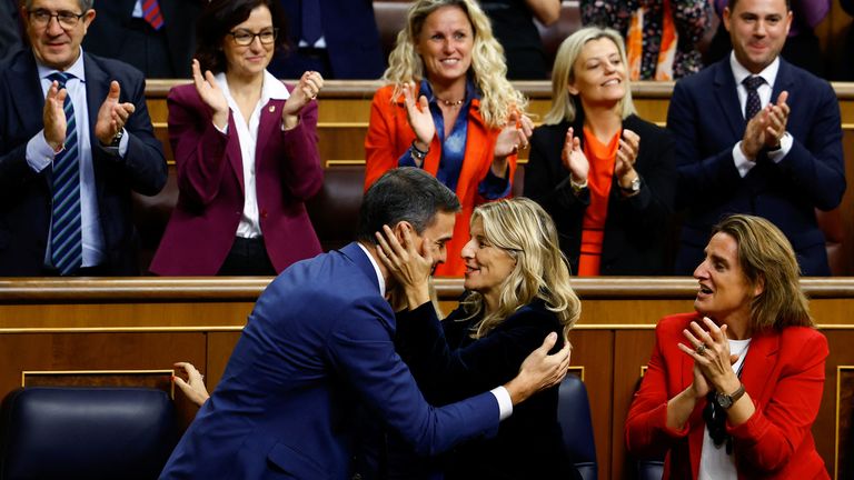Yolanda Diaz congratulates Spain&#39;s newly re-appointed Prime Minister Pedro Sanchez after the voting at the investiture debate, as Spain&#39;s Socialists clinched a new term following a deal with the Catalan separatist Junts party for government support, a pact which involves amnesties for people involved with Catalonia&#39;s failed 2017 independence bid, in Madrid, Spain November 16, 2023. REUTERS/Susana Vera