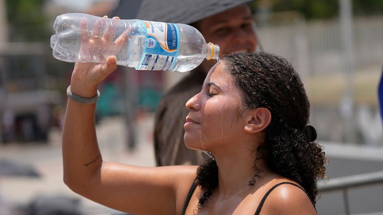 A Taylor Swift fan cools down in Rio. Pic: AP