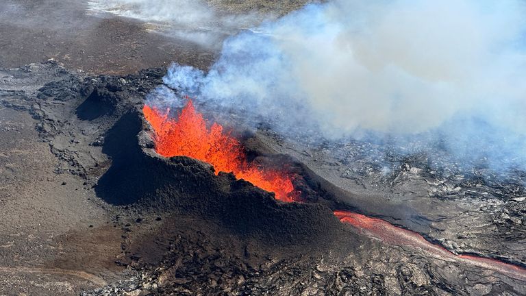 Lava spurts and flows after the eruption of a volcano in the Reykjanes Peninsula in July 2023