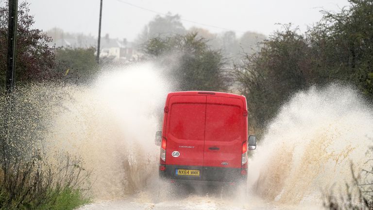 A van drives through flood water in Whitley Bay, north east England 