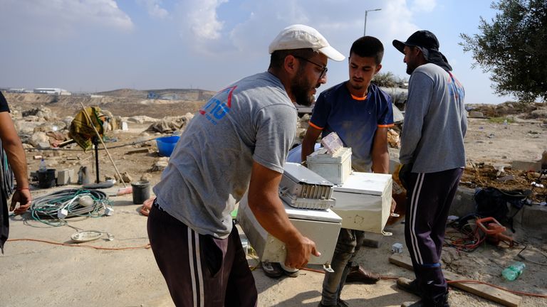 Men packing to leave Zanota 