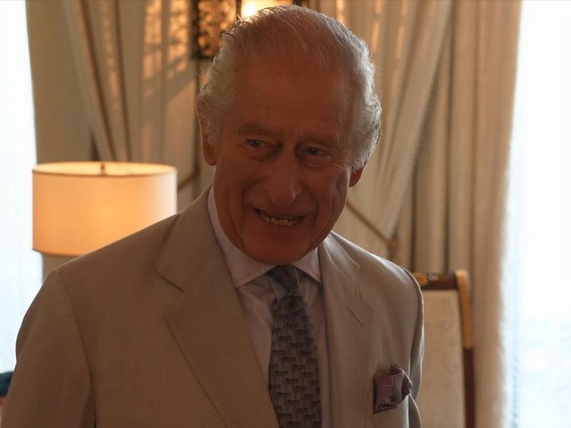 King Charles says 'I'm alright... just about' amid Omid Scobie book revelations.