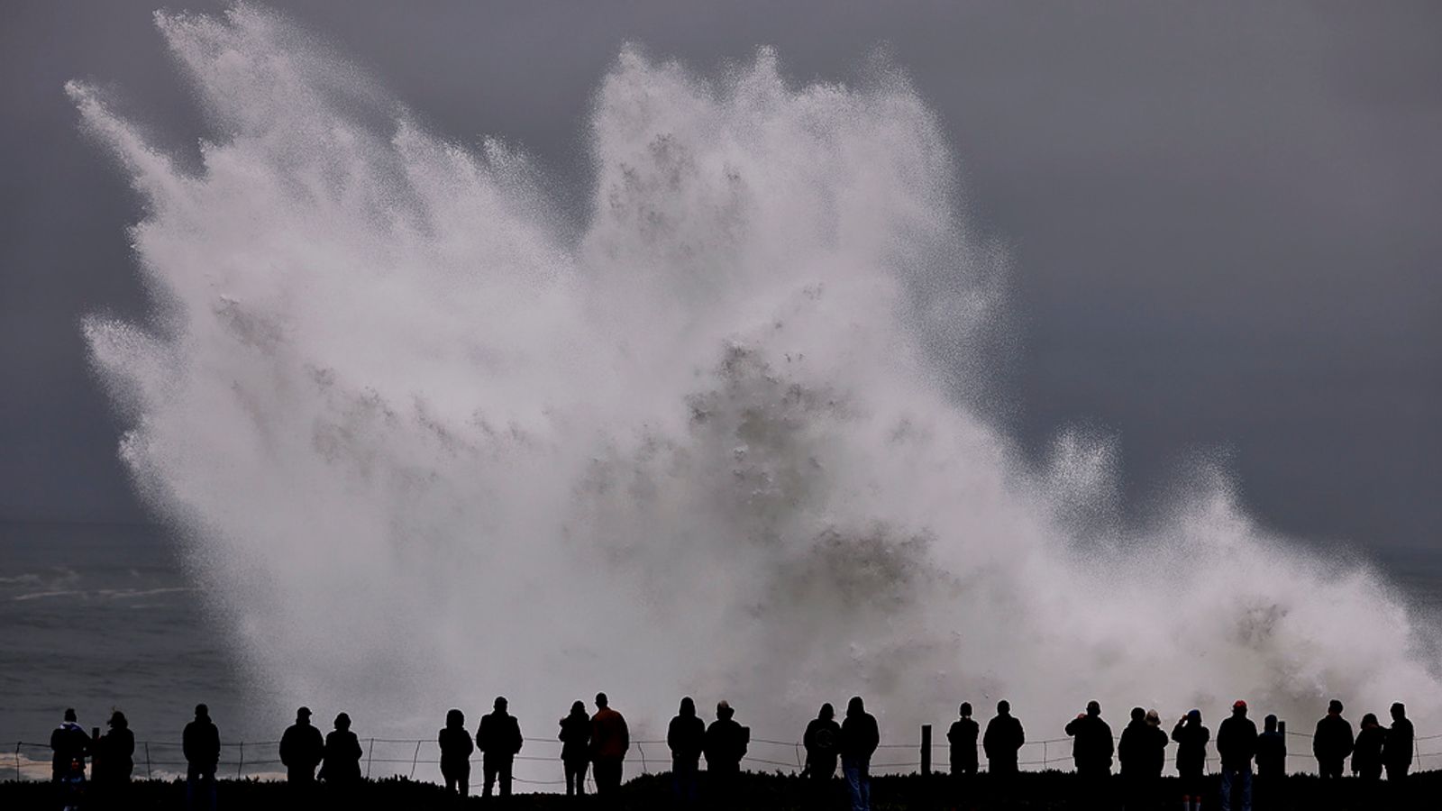 Huge waves smash California beaches, injuring eight and leaving buildings flooded