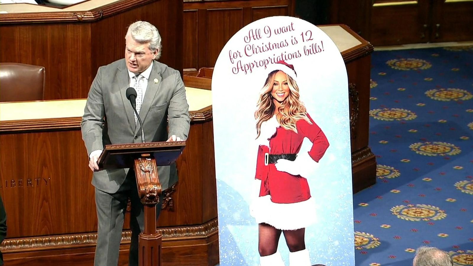 Congressman uses Mariah Carey poster to encourage colleagues to avoid a