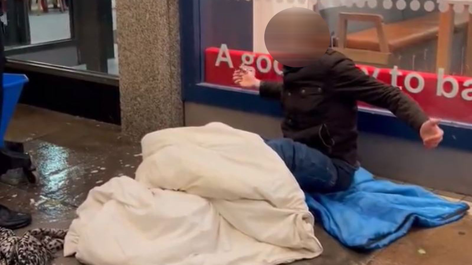 'Bang out of order': Anger as security guard mops floor where homeless man is sitting