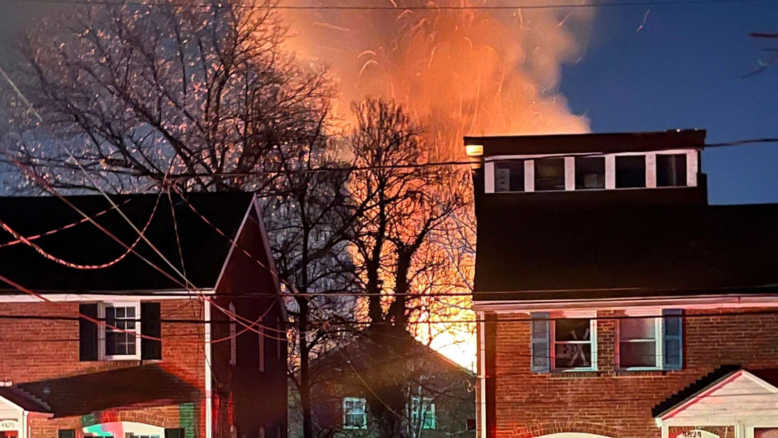 House explodes in Virginia as police surround armed suspect inside