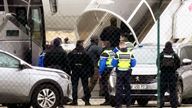 Men board the plane grounded by police at the Vatry airport 