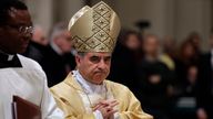 FILE - In this Feb. 9, 2017 file photo, Mons. Giovanni Angelo Becciu presides over a eucharistic liturgy, at St. John in Lateran Basilica, in Rome. Lawyers for the once-powerful cardinal have accused Vatican prosecutors of being ...prisoners to their completely shattered theory" in closing arguments of a two-year trial. Becciu is on trial along with nine other people in..a case..that is focused on the Vatican...s 350 million-euro investment in a London property. (AP Photo/Gregorio Borgia, File)