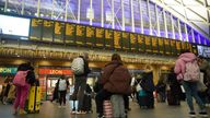 Passengers looking at departure boards at Kings Cross station, London, as the getaway for the festive period continues. Picture date: Saturday December 23, 2023. 