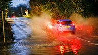 Station Lane, Godalming. 12th December 2023. Intense rainfall across the Home Counties this afternoon leading to surface flooding. Vehicles driving through floodwater in Godalming in Surrey. Credit: james jagger/Alamy Live News
