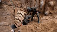Israeli soldiers operate at the opening to a tunnel at Al Shifa Hospital compound in Gaza City, amid the ongoing ground operation of the Israeli army against Palestinian Islamist group Hamas, in the Gaza Strip, November 22, 2023. REUTERS/Ronen Zvulun/File Photo