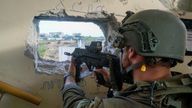 An Israeli soldier aims a weapon as they operate in Gaza on 1 December. Pic: Israel Defence Forces