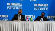 Home Secretary James Cleverly and Rwandan Minister of Foreign Affairs Vincent Biruta sign a new treaty. The treaty will address concerns by the Supreme Court, including assurances that Rwanda will not remove anybody transferred under the partnership to another country.  Picture date: Tuesday December 5, 2023. PA Photo. See PA story POLITICS Rwanda. Photo credit should read: Ben Birchall/PA Wire 