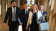 Deputy First Minister Shona Robison alongside First Minister Humza Yousaf as they make their way to the chamber to outline the draft budget for 2024-25 in a statement to MSPs in the Scottish Parliament, Edinburgh. Picture date: Tuesday December 19, 2023