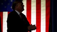 Former President Donald Trump takes the stage at a campaign rally Saturday Dec. 16, 2023, in Durham, N.H. (AP Photo/Reba Saldanha)