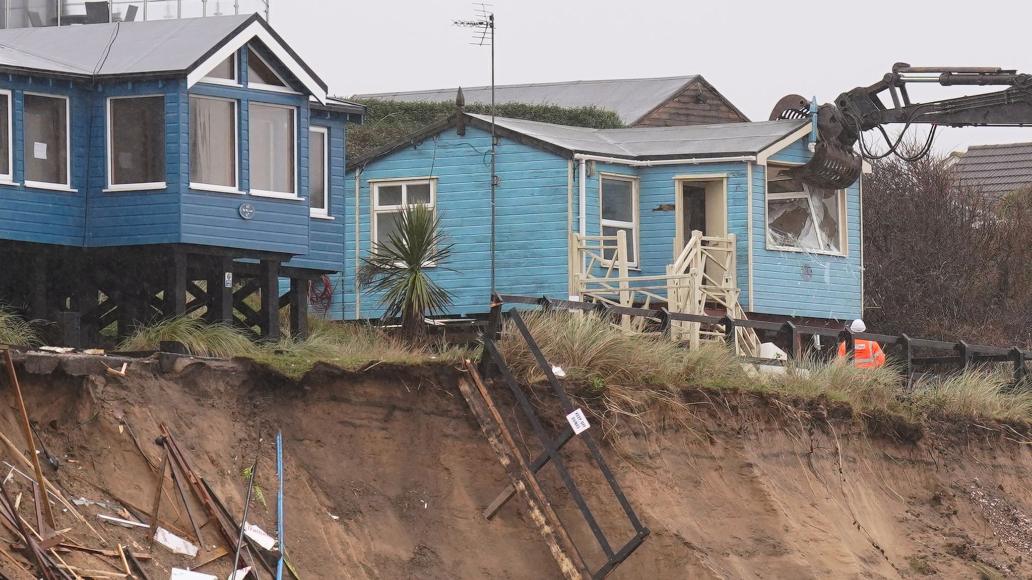 Demolition Of Homes Teetering On Eroding Clifftop Gets Under Way In ...