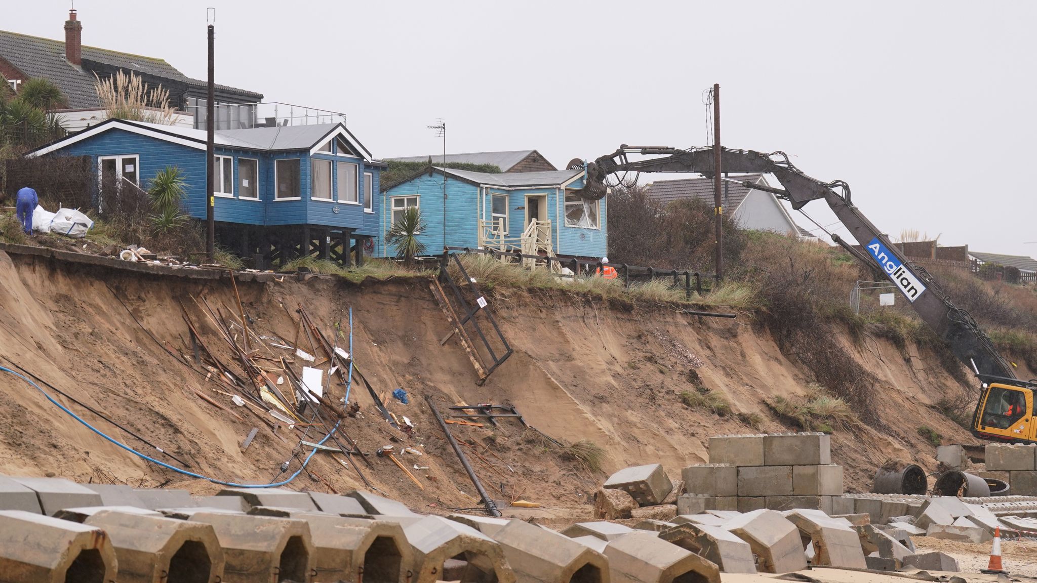 Demolition Of Homes Teetering On Eroding Clifftop Gets Under Way In ...