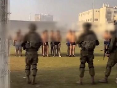 Israel-Hamas war: Video appears to show IDF soldiers rounding up half