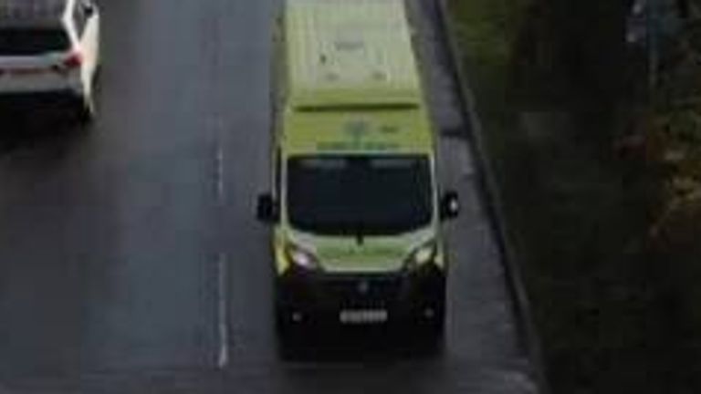 An ambulance drives