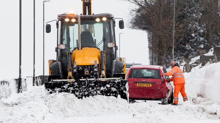 A car gets stuck in snow in  Hayfield in Derbyshire during the "mini beast from the east" in 2018                                                                                       