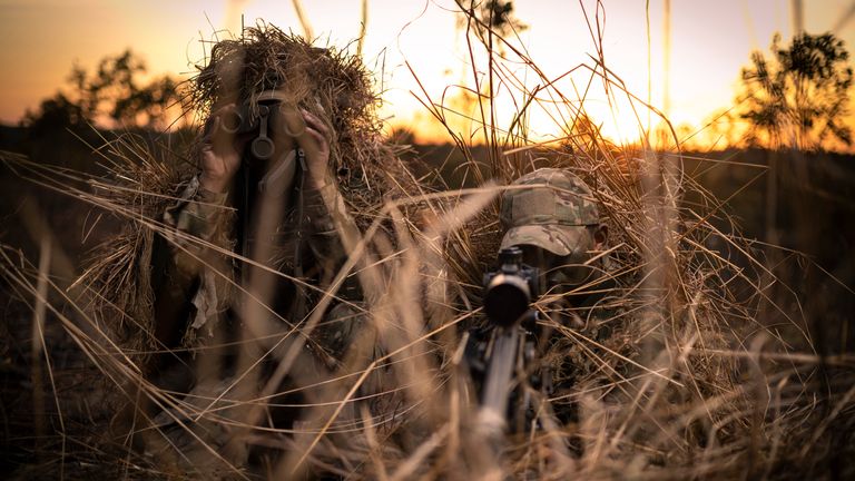 A spotter and sniper team of Support Company, 1st Battalion (1RGR) The Royal Gurkha Rifles, look through their sights and take cover to look onto enemy positions within their OP (observation point)...Soldiers from C Company 1st Battalion (1RGR) The Royal Gurkha Rifles based in Brunei are deployed in the Northern Territory of Australia taking part in Exercise Pacific Kukri, a multi-national joint exercise with the Australian Defence Force and U.S Marine Corps...Pacific Kukri is a 5 week deployment and gives the opportunity for 1RGR to undertake defence engagement activities by developing interoperability between the Australian Defence Force & US Marines enhancing relationships within the IAP (Indo-Pacific Asia)....