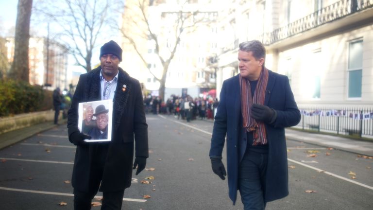 Charlie Williams, holding a picture of his dead dad Rex, speaking to Sky News&#39; Nick Martin.