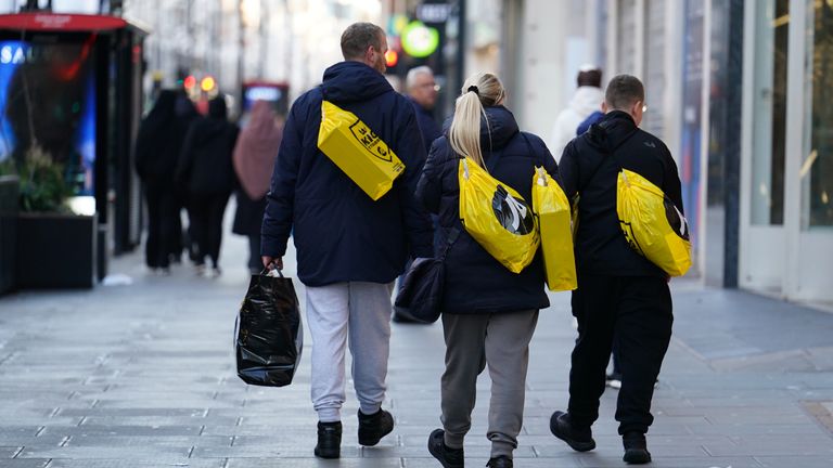 A handful of shoppers walk along Oxford Street in central London during the Boxing Day sales. Picture date: Tuesday December 26, 2023.
