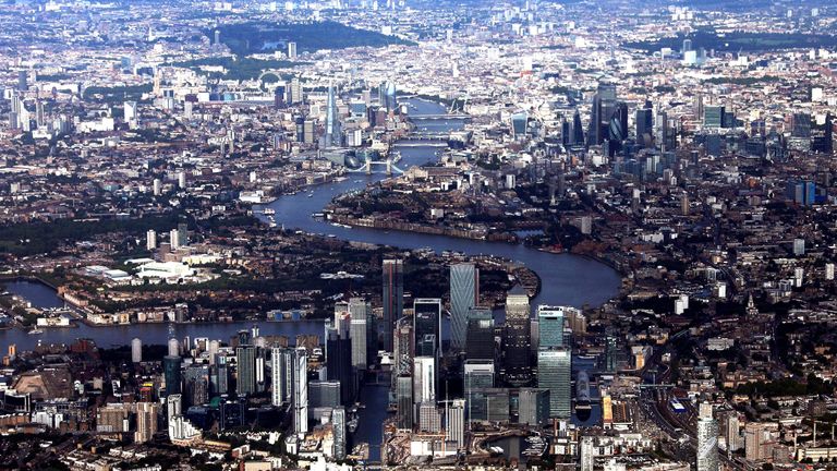Canary Wharf and the City of London financial district are seen from an aerial view in London, Britain, August 8, 2019. REUTERS/Hannah McKay
