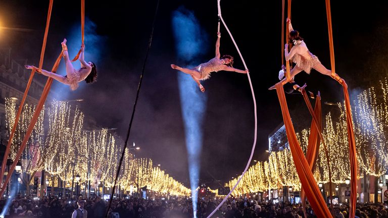 Dancers perform during a New Year&#39;s celebration on the Champs Elysees in Paris, France, Sunday, Dec. 31, 2023. (AP Photo/Aurelien Morissard)