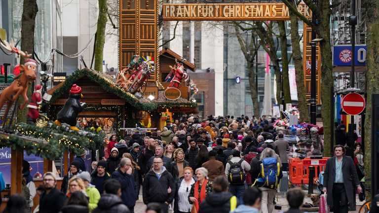 Shoppers walk by the Christmas markets on New Street in Birmingham, ahead of Christmas Day on Monday. Picture date: Saturday December 23, 2023.
