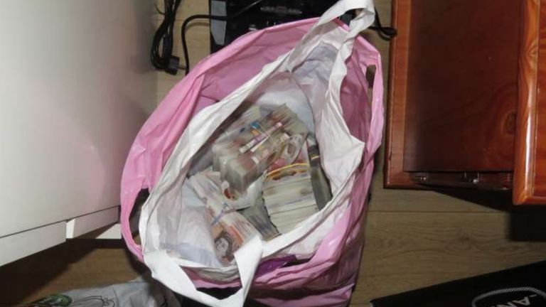 A bag of cash found at Ermal Shtrezi&#39;s address Pic: Met Police 