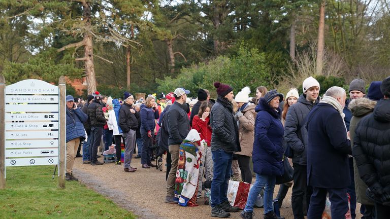 Crowds  wait to greet the members of the royal family attending the Christmas Day morning church service at St Mary Magdalene Church in Sandringham, Norfolk