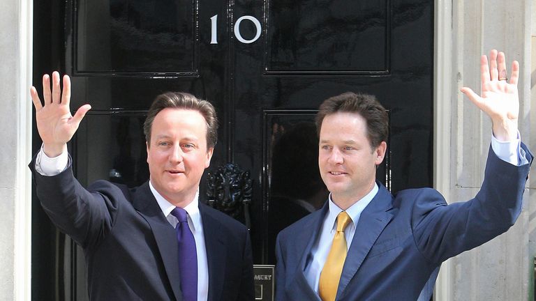 The new British Prime Minister David Cameron (left) with the new Deputy Prime Minister Nick Clegg on the steps of 10 Downing Street in central London, before getting down to the business of running the country. 