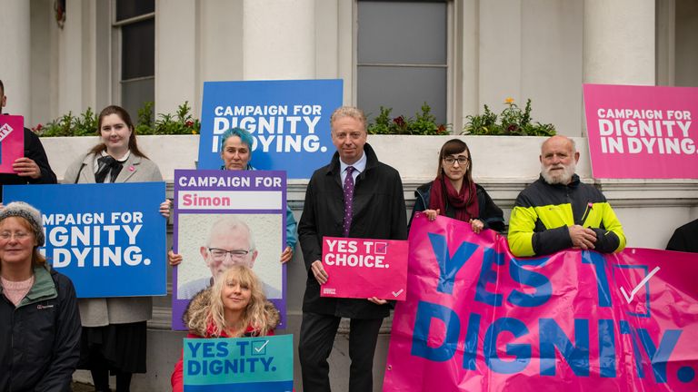 Dr Alex Allinson (centre) with pro-assisted dying campaigners. Pic: Dignity in Dying