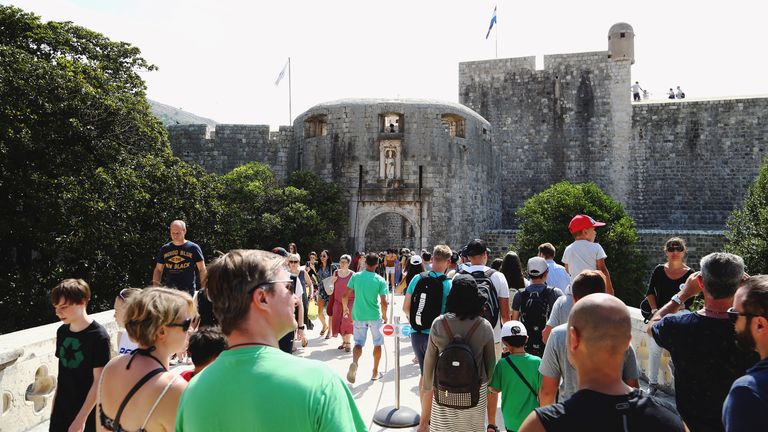 People walk through Dubrovnik in Croatia 