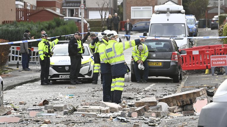 Gas engineers and police officers at the scene on Baberton Mains Avenue, Edinburgh, after an 84-year-old man has died following an explosion at a house on Friday night. Picture date: Saturday December 2, 2023.