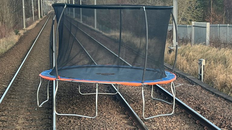 Handout photo issued by Network Rail of a 10ft trampoline which was blown onto the main line between Glasgow Central and Edinburgh