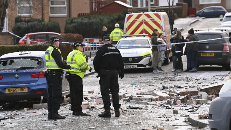 Police officers at the scene on Baberton Mains Avenue, Edinburgh, after an 84-year-old man has died following an explosion at a house on Friday night. Picture date: Saturday December 2, 2023.