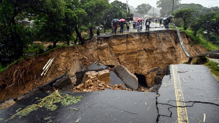 A road connecting the two cities of Blantyre and Lilongwe is seen damaged following heavy rains caused by Tropical Cyclone Freddy in Blantyre, Malawi Tuesday, March 14 2023. (AP Photo/Thoko Chikondi)