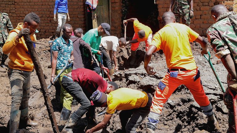 Members of the Tanzania Defense Forces and rescuers search for the bodies of people killed following flash floods and landslides near the slopes of Mount Hanang in the Manyara region, Tanzania, December 4, 2023. REUTERS/Stringer