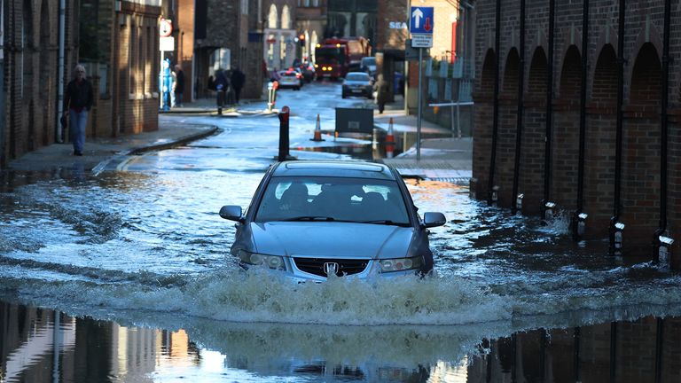 Drivers forced to abandon cars as more than 180 areas on flood watch ...