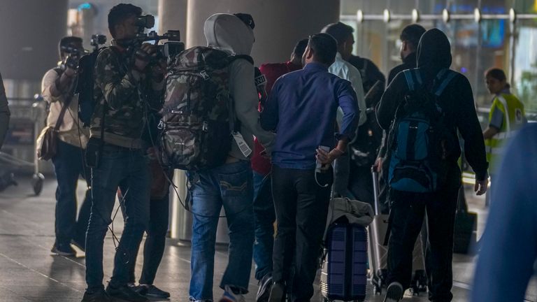 Indian passengers arrive at the Chhatrapati Shivaji Maharaj International Airport in Mumbai from France