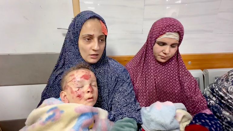 A woman with her two-year-old inside Kamal Adwan Hospital